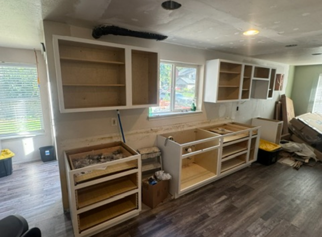 Kitchen cabinets before being finished in green