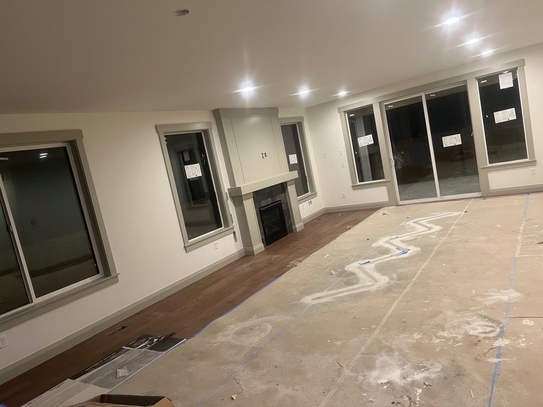 Finished interior room with windows and painted walls